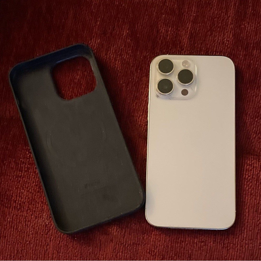 iPhone 14 Pro Max white with Mag Safe leather case.